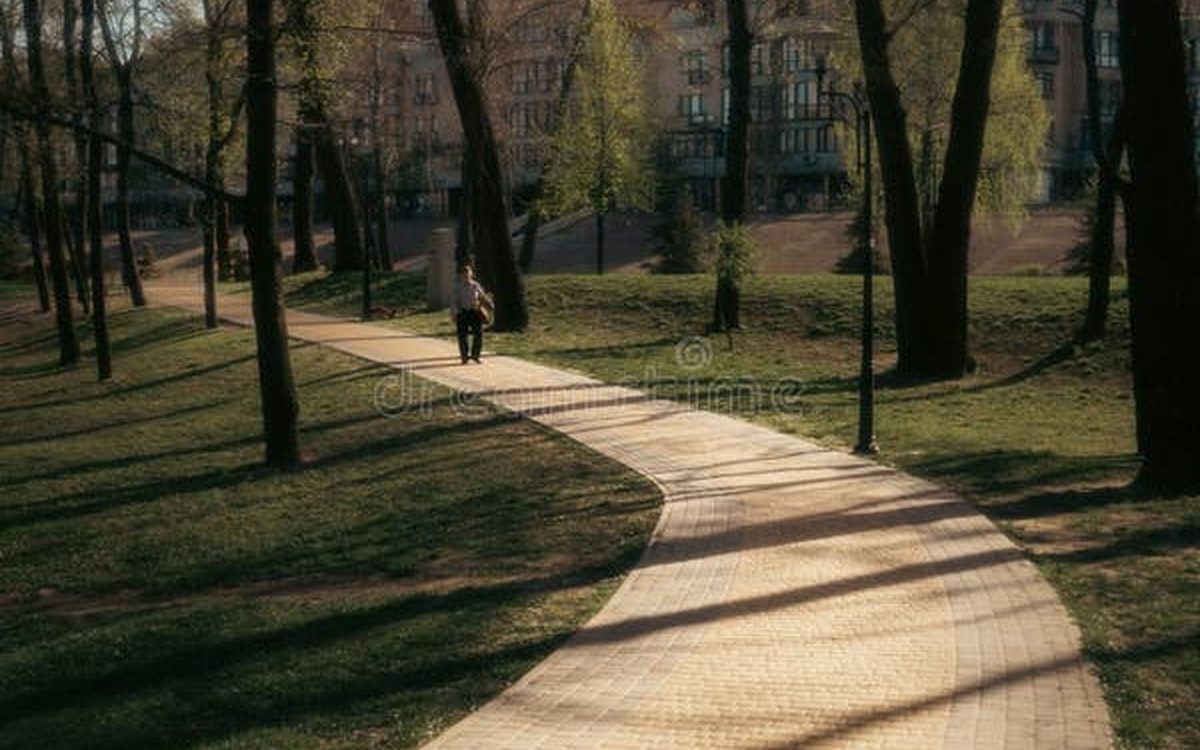 Illustration of a person walking along a path through green hills